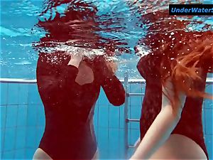 2 steaming teens underwater