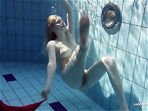 steamy light-haired Lucie French teenager in the pool