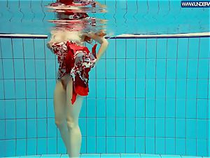 torrid grind redhead swimming in the pool