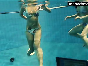 two fantastic amateurs displaying their figures off under water